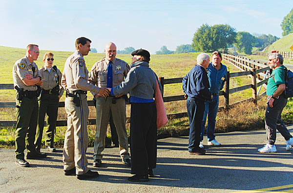 Patricia Tuttle-Brown shakes hands with police officers