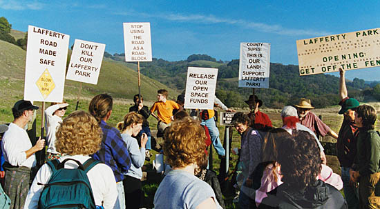The group rallies with signs around Lafferty gate