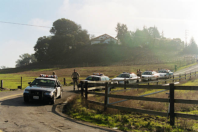 Police cars across the road from the Lafferty gate.