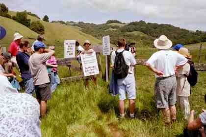 Bruce addresses the group at the gate.