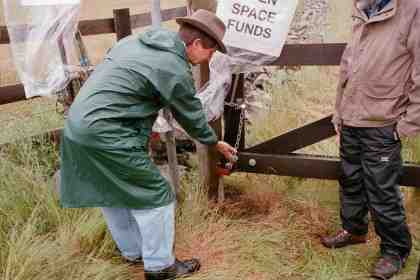 Bruce deposits "quarry fines" in front of the gate.